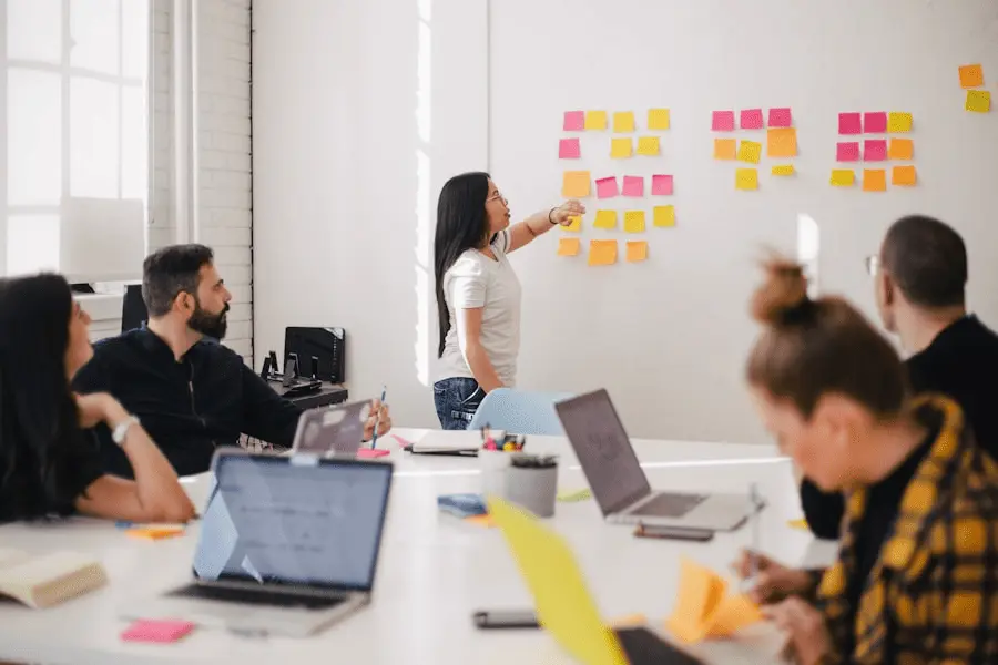 Collaborative digital marketing agency team brainstorming campaign ideas using sticky notes during a business growth strategy session.